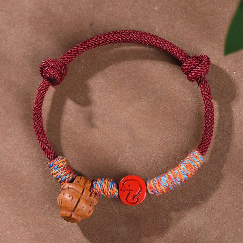 Handmade Chinese Zodiac Red String Peach Pit Cinnabar Luck Bracelet