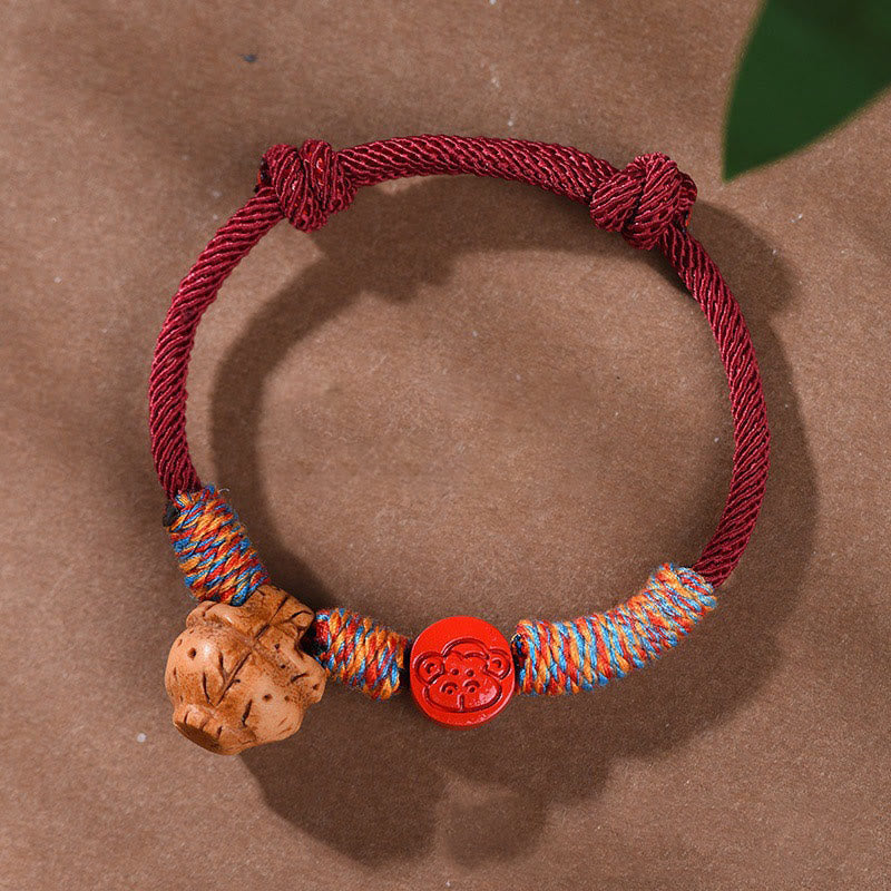 Handmade Chinese Zodiac Red String Peach Pit Cinnabar Luck Bracelet