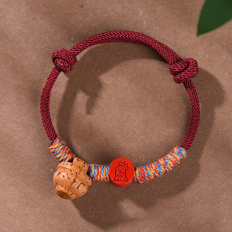Handmade Chinese Zodiac Red String Peach Pit Cinnabar Luck Bracelet