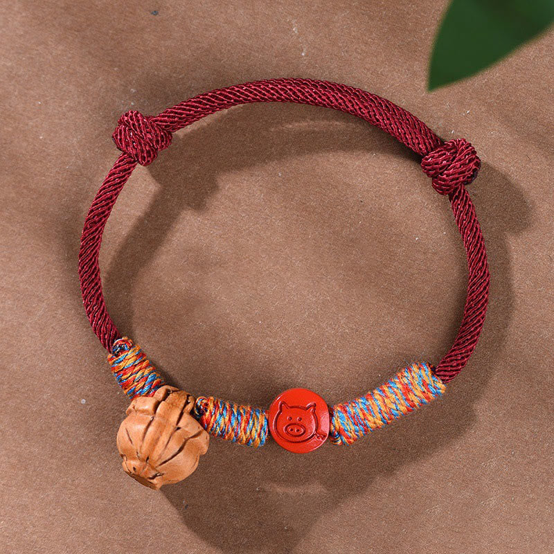 Handmade Chinese Zodiac Red String Peach Pit Cinnabar Luck Bracelet