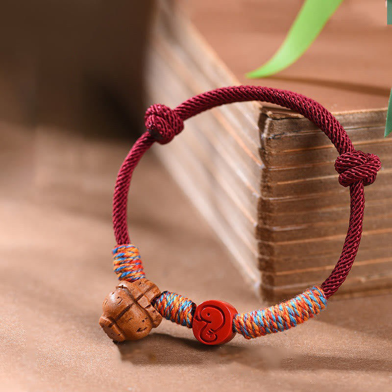 Handmade Chinese Zodiac Red String Peach Pit Cinnabar Luck Bracelet